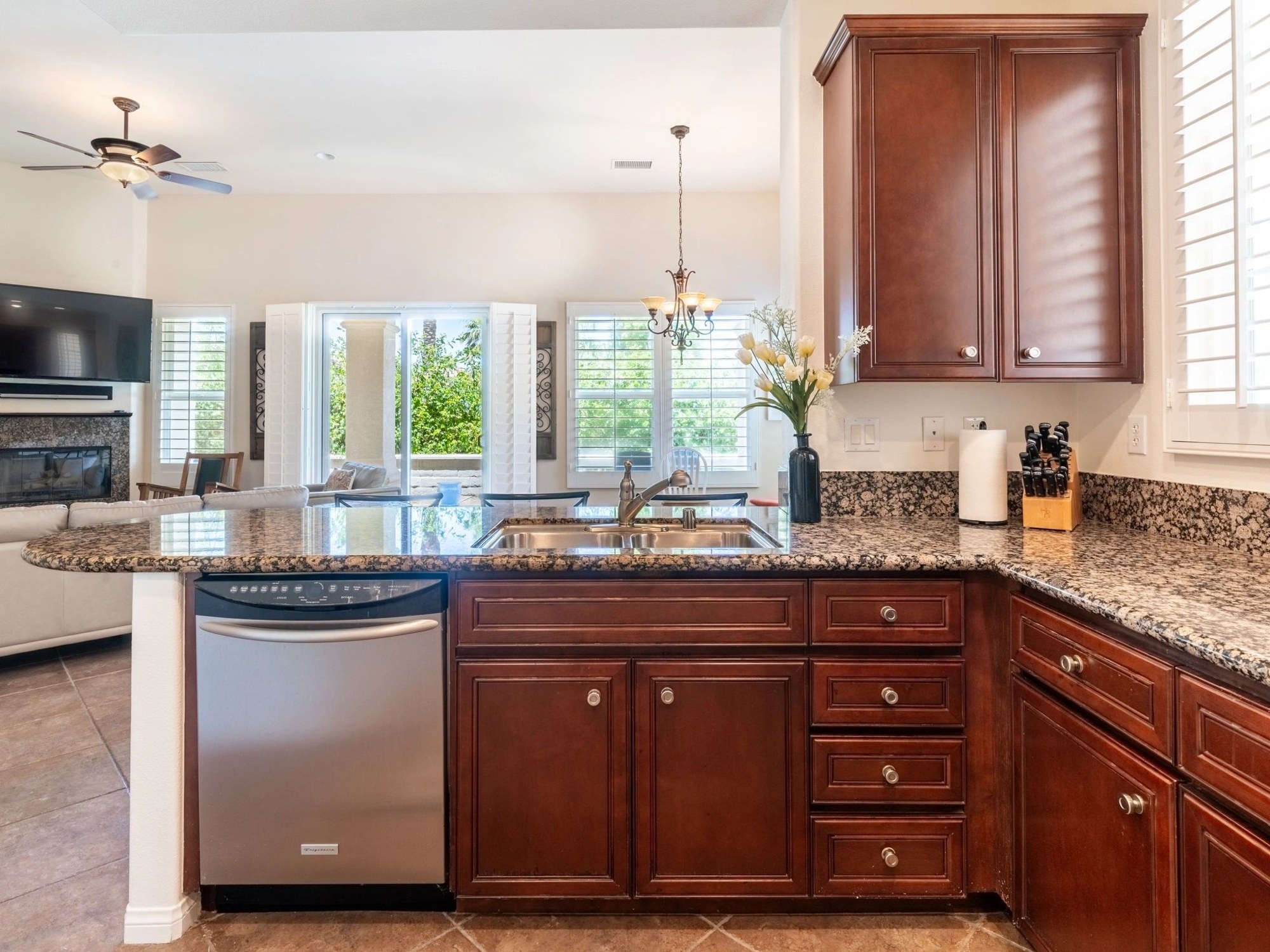 Modern kitchen with granite countertops and stainless dishwasher